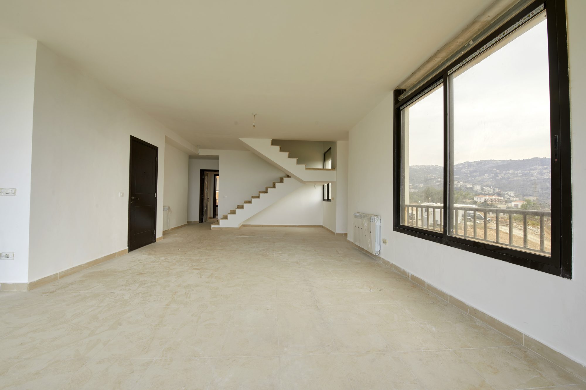 Duplex living space with its staircase and mountain views