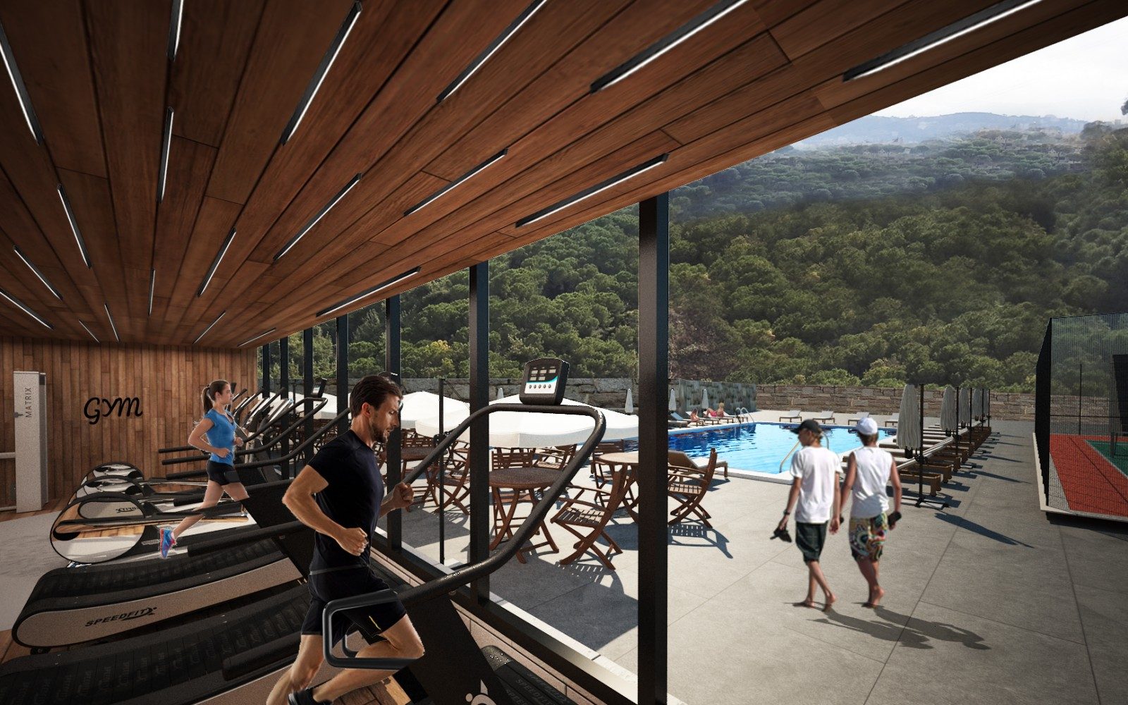 The gym with treadmills overlooking the pool and the wooded valley