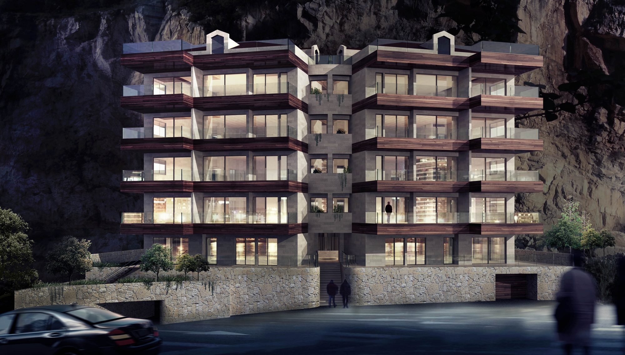 Pride of Martakla 2 at night, stone and wood facade against the cliff